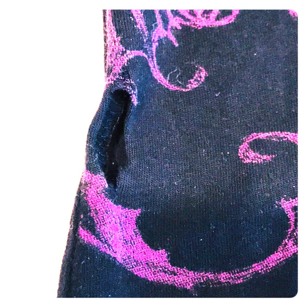 Details of hole discovered in seam on Sinful Tee.